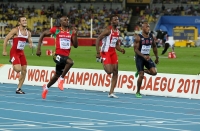 *Фото с Чемпионата Мира 2011 (Тэгу, Корея). Забеги на 100м. Ким Кооллинс и Трелл Кимомнс